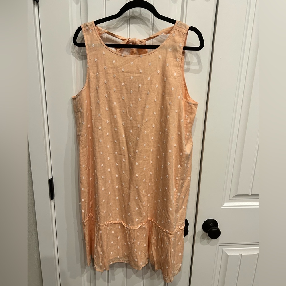 Peach loft midi dress with embroidered white polka dots.